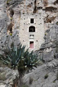 A vertical crack in the rock of the Marjan peninsula was used to create a small house for a hermit in the medieval period. exterior view.W