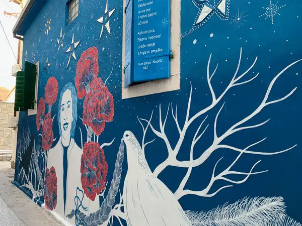 Night time view of a mural in Palmina Ulica, Split, Croatia, a memorial to resistance fighter Palmina Piplovic